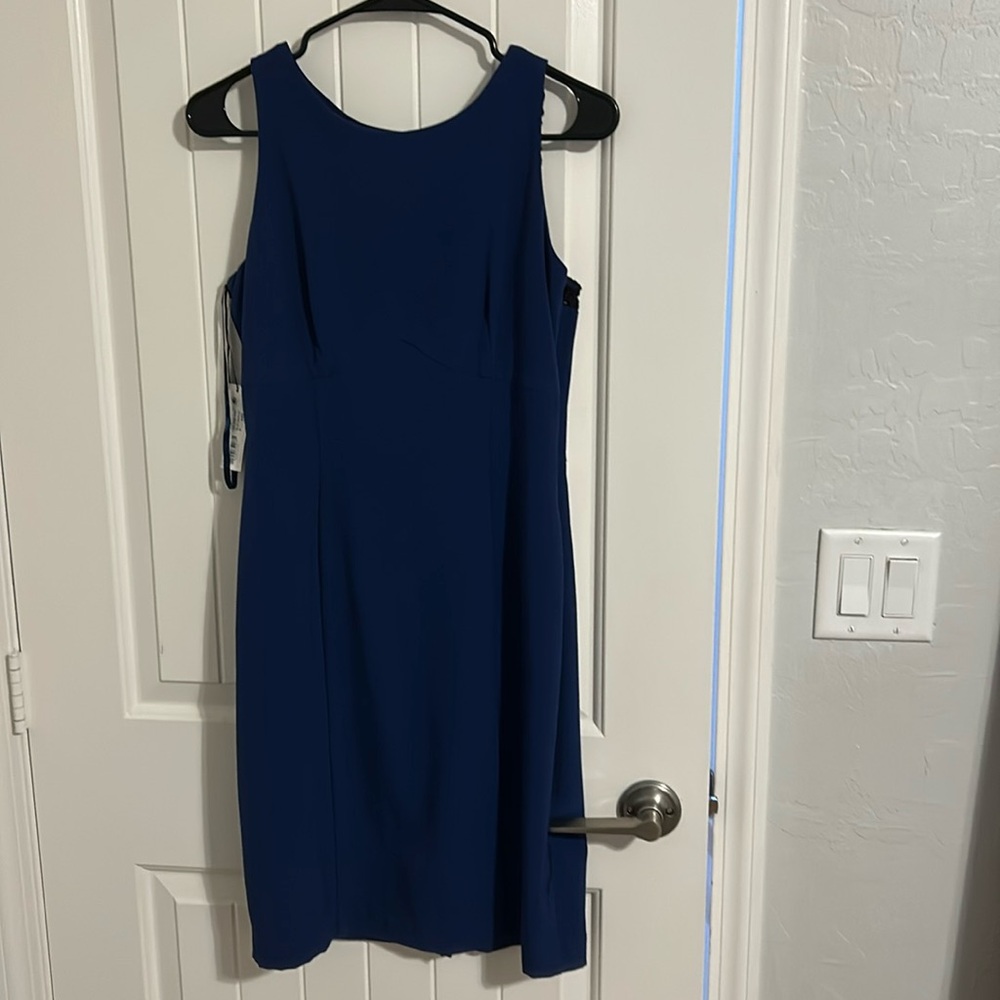 Women NWT size 6 blue dress w/black lace on upper back.